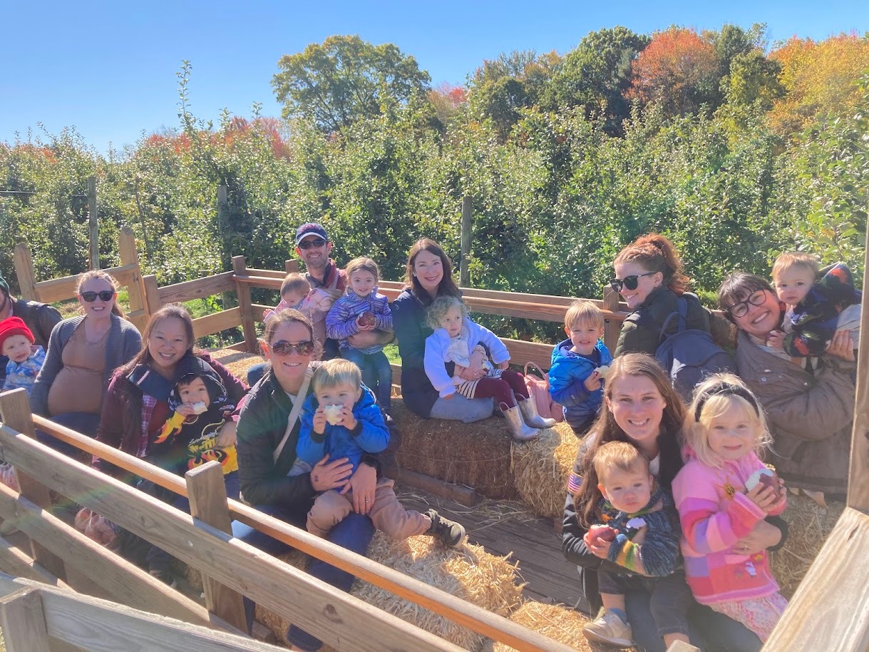 Waltham Cooperative Playgroup families enjoying a fall hayride together