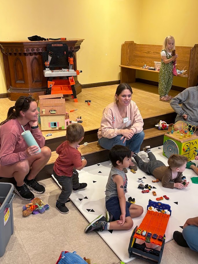 Parents and children playing together at Waltham Cooperative Playgroup